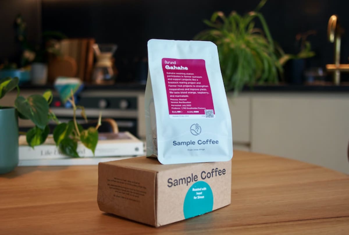 Photo of a bag of Brew Crew coffee, sitting on top of the delivery box, and on a kitchen table