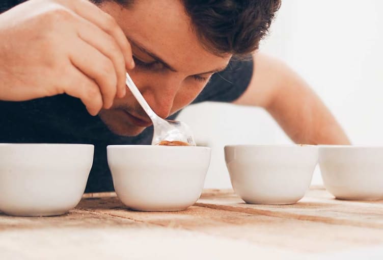 Image of someone making Cupping coffee at home