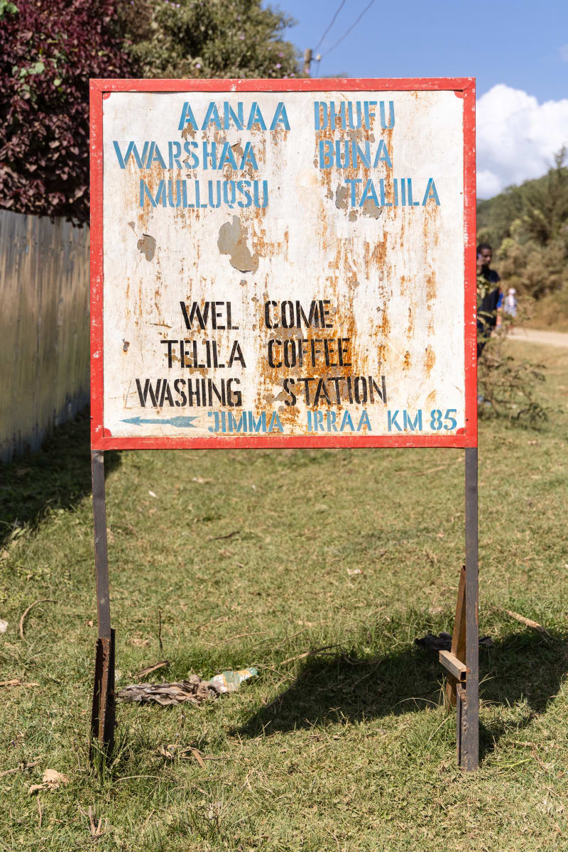 A sign at the entrance of the Telila washing station.