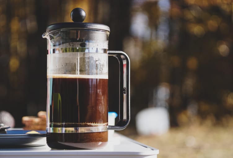 Image of someone making French press (plunger)