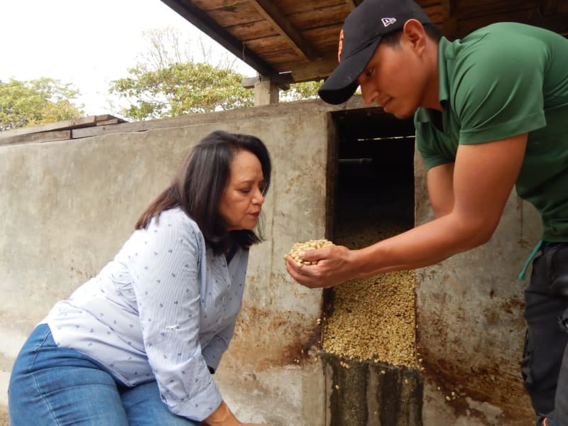 Maria Esther and her coffee beans.